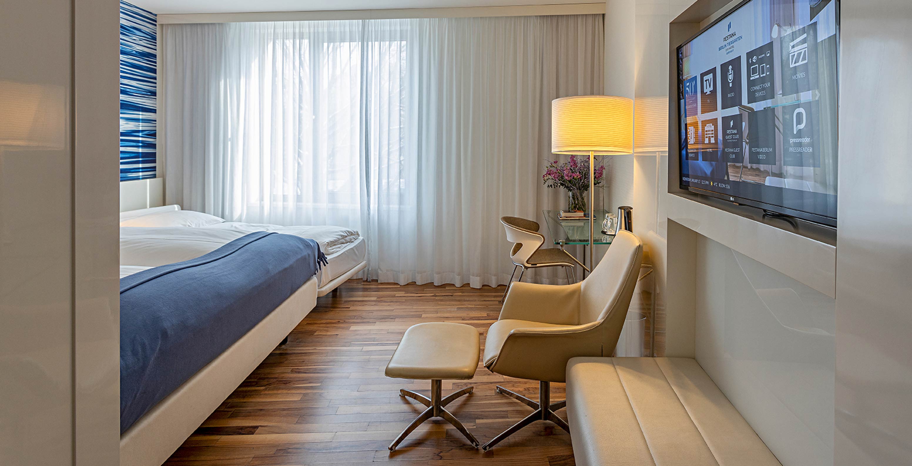 Family Deluxe has a desk, lounge chair and TV