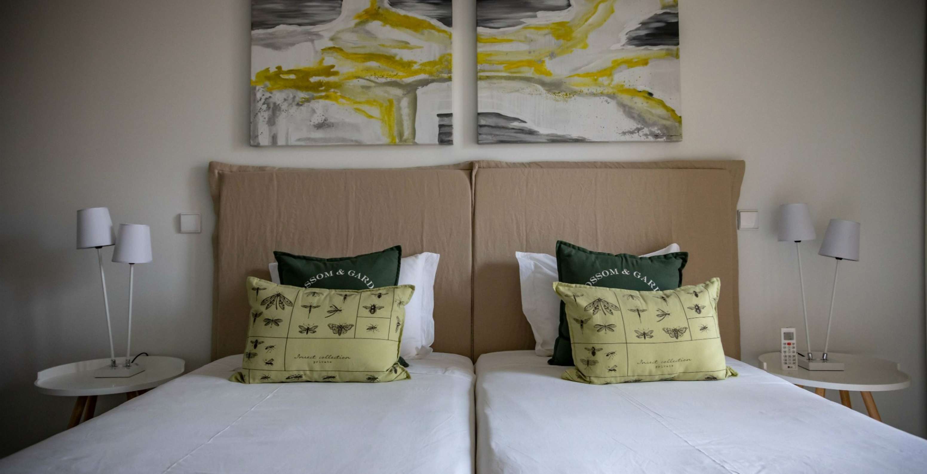 The Eco Village Apartment Ground Floor of Pestana Tróia Eco Resort has two beds combined and pictures on the wall