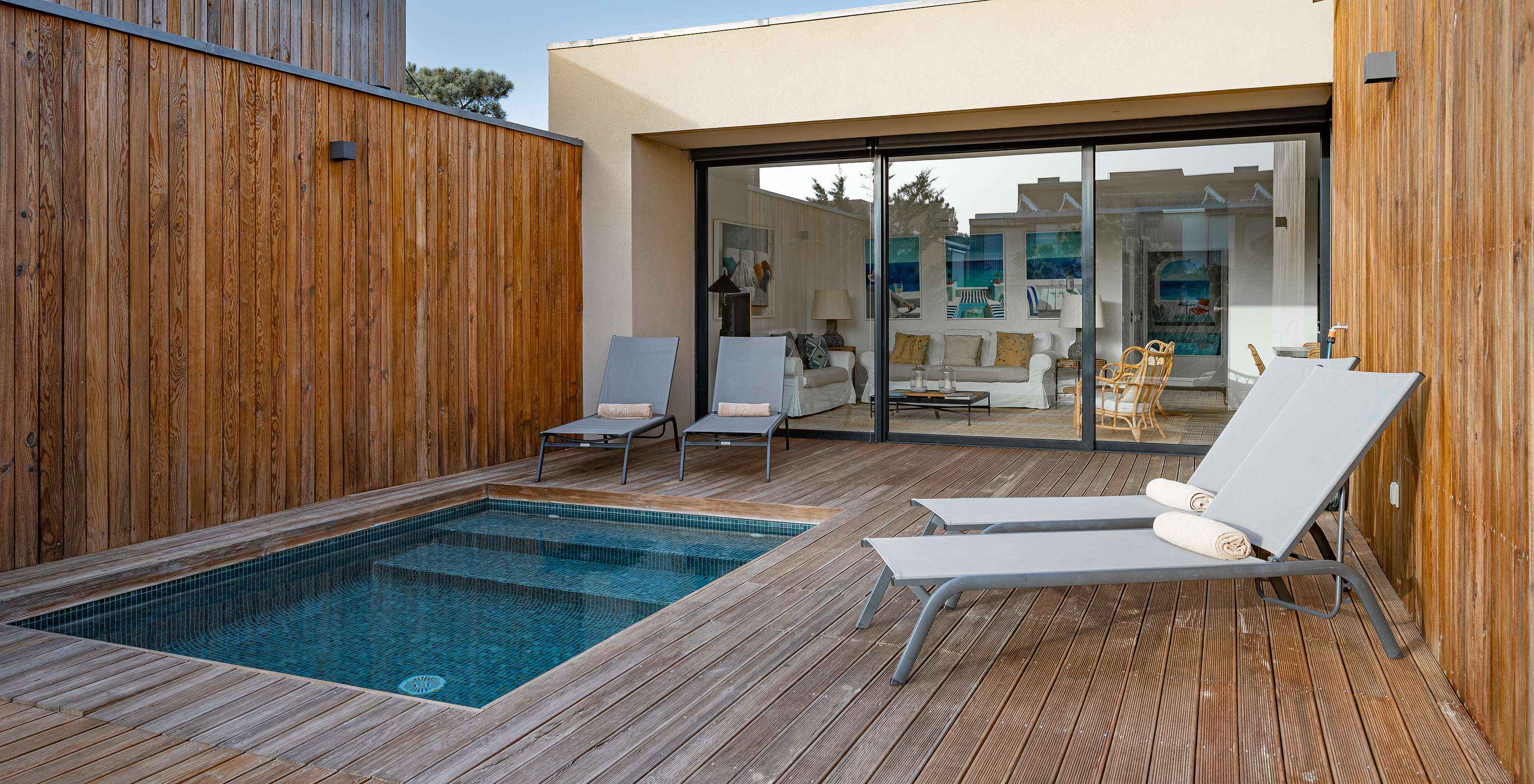 The Pine Villas of Pestana Tróia Eco Resort have a private pool and two sun loungers