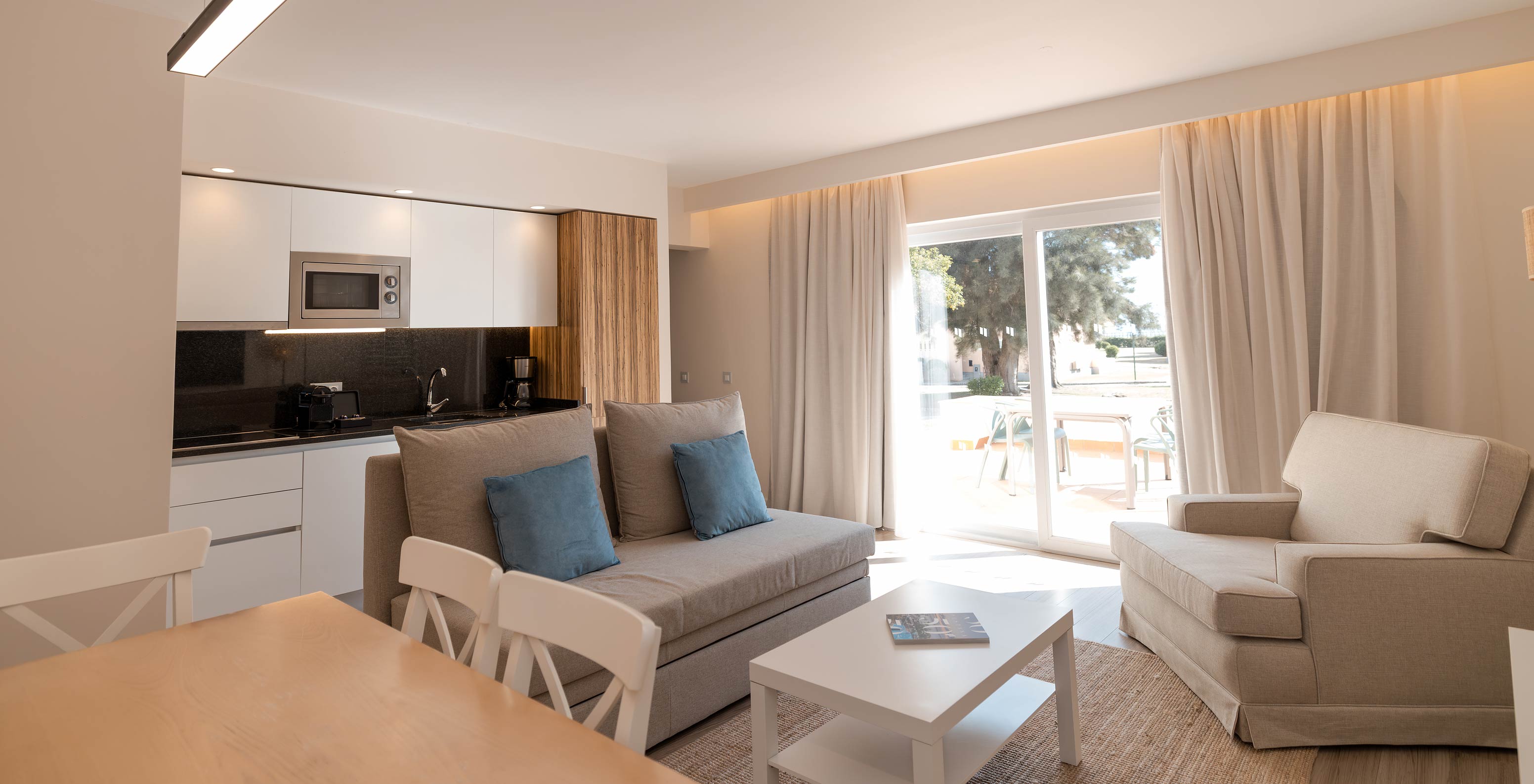 Villa 2 Bedrooms Premium at Pestana Alvor Beach Villas has a living room with balcony access and equipped kitchen