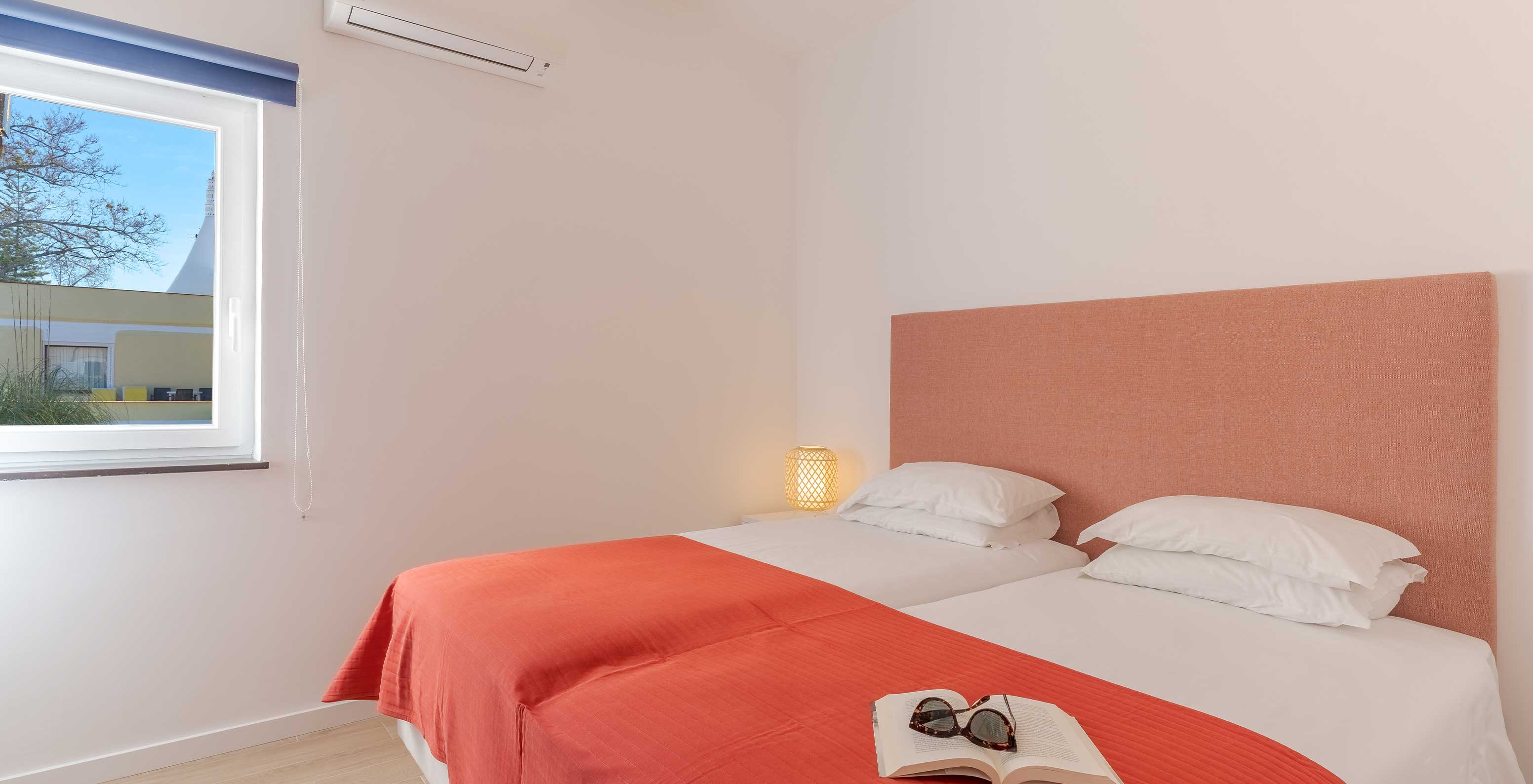 The 3 Bedroom Garden View Villa at Pestana Alvor Beach Villas has a bedroom with two single beds