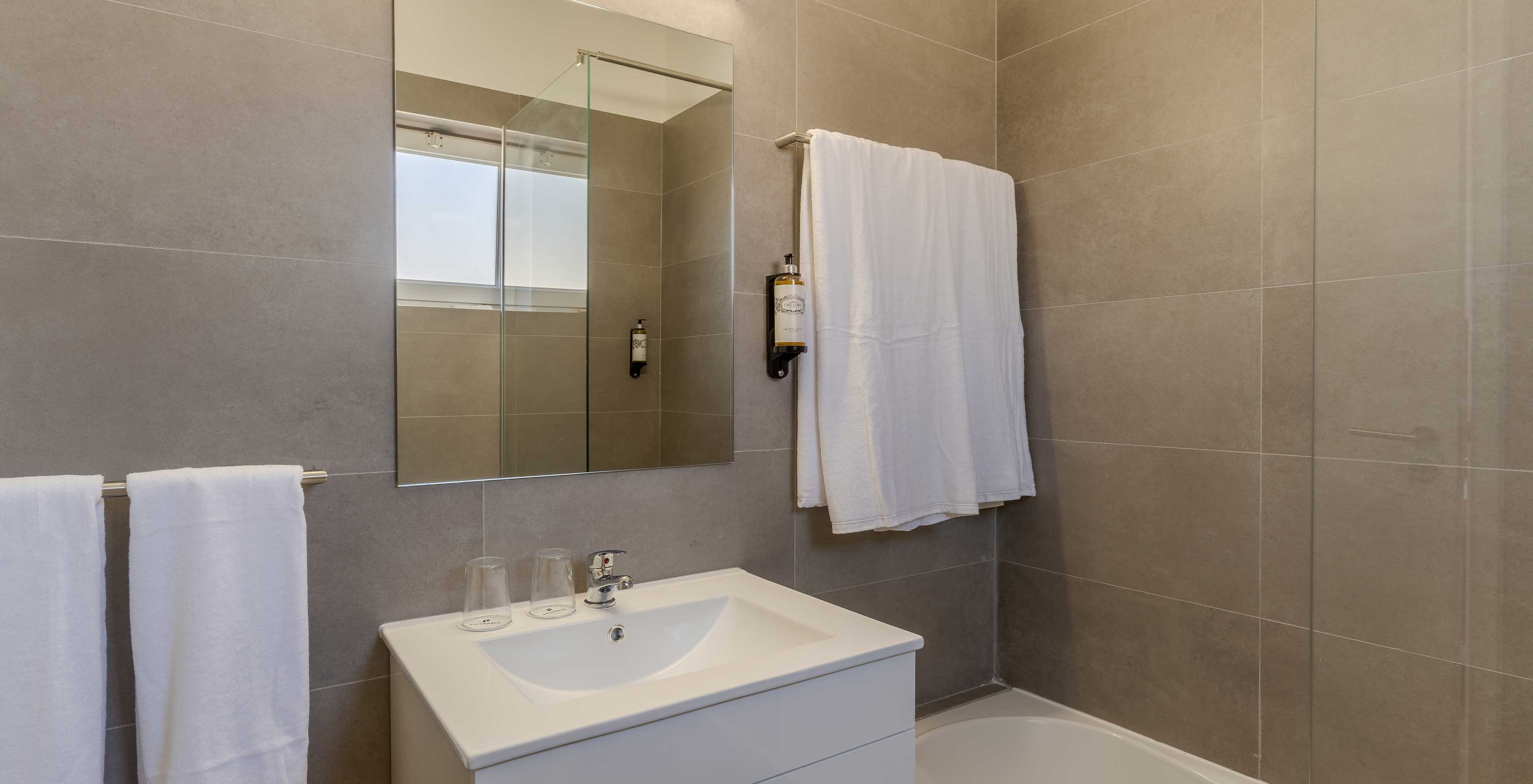 The 3 Bedroom Premium Sea View Villa at Pestana Alvor Beach Villas has a bathroom with a sink and towel