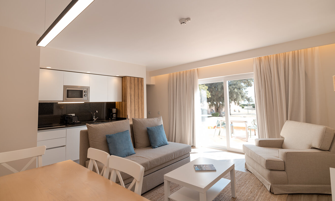 Villa 2 Bedrooms Premium at Pestana Alvor Beach Villas has a living room with balcony access and equipped kitchen