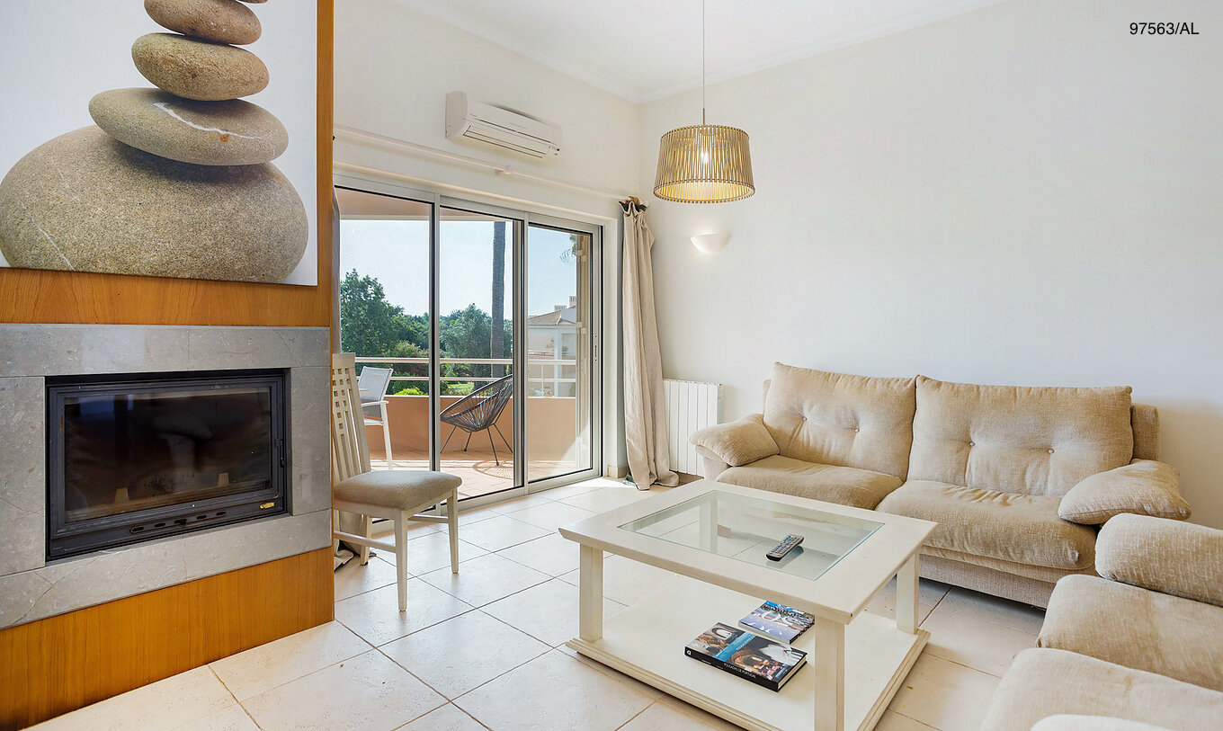 The Pestana Carvoeiro Golf T3 Superior Apartment has a living room with a fireplace, sofas, and a coffee table