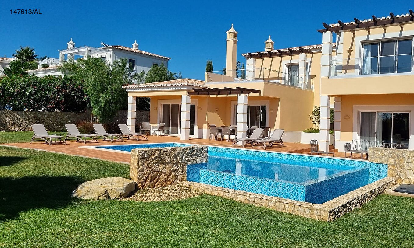 The Pestana Carvoeiro Golf V5 Superior Villa has an exterior patio with a pool, grass, and loungers