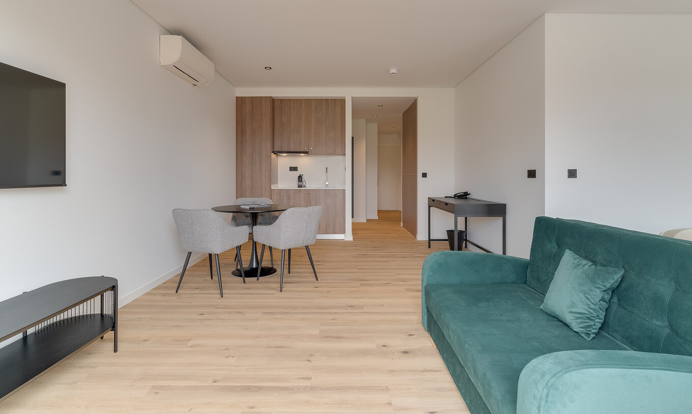 The Family with Balcony - Clubhouse of Pestana Sintra Golf has a sofa, television, air conditioning, a table, and kitchenette