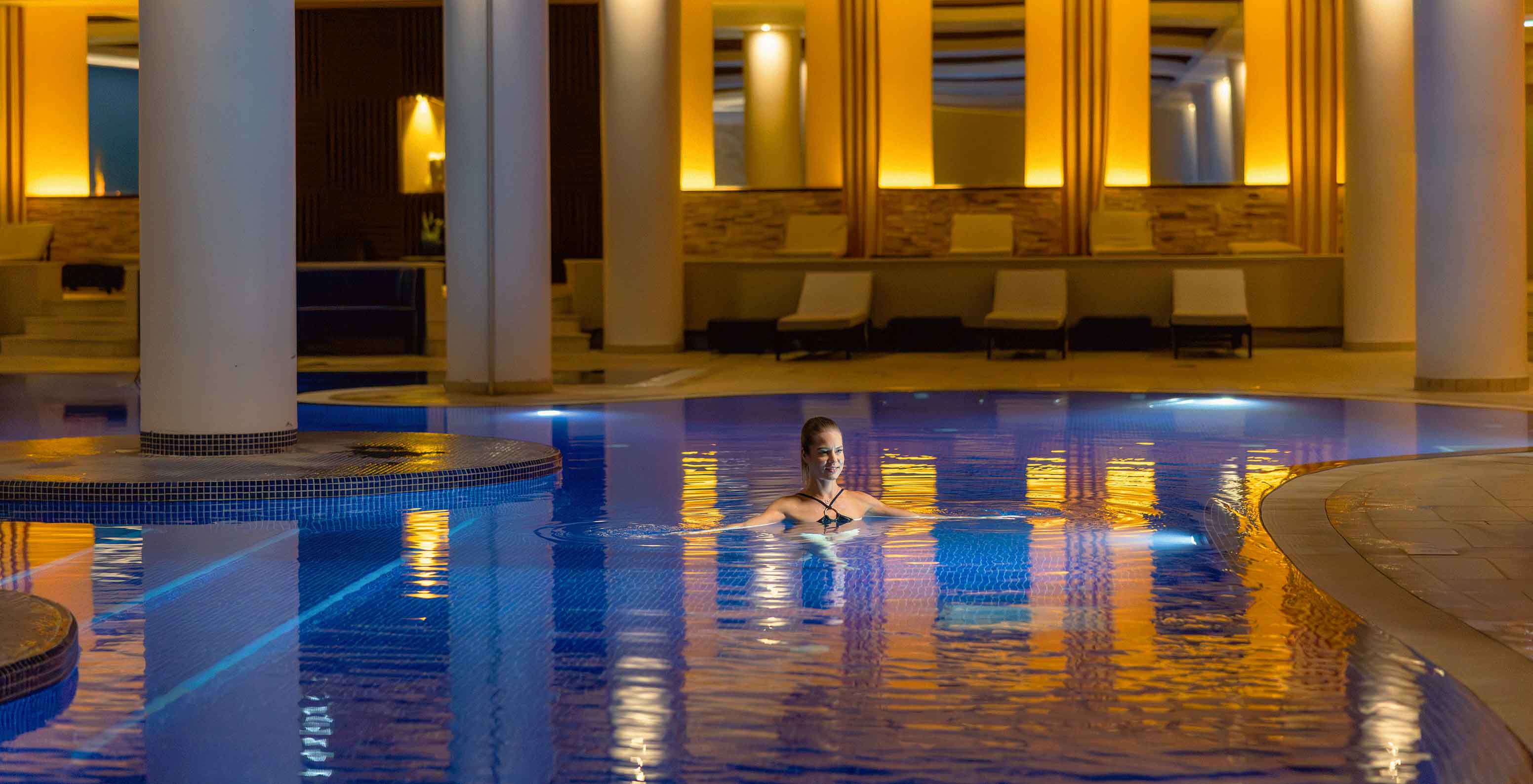 Indoor pool with serene atmosphere at Pestana Casino Park, hotel in Funchal by the sea, with spa and pool