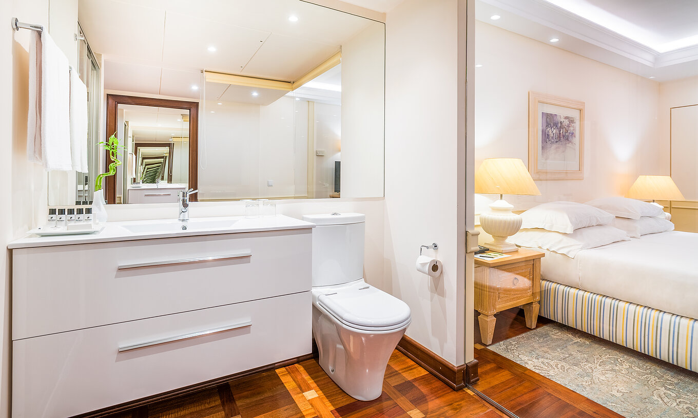 The Superior Deluxe Room with Balcony of Pestana Royal All Inclusive has a bathroom with mirror, sink, and toilet