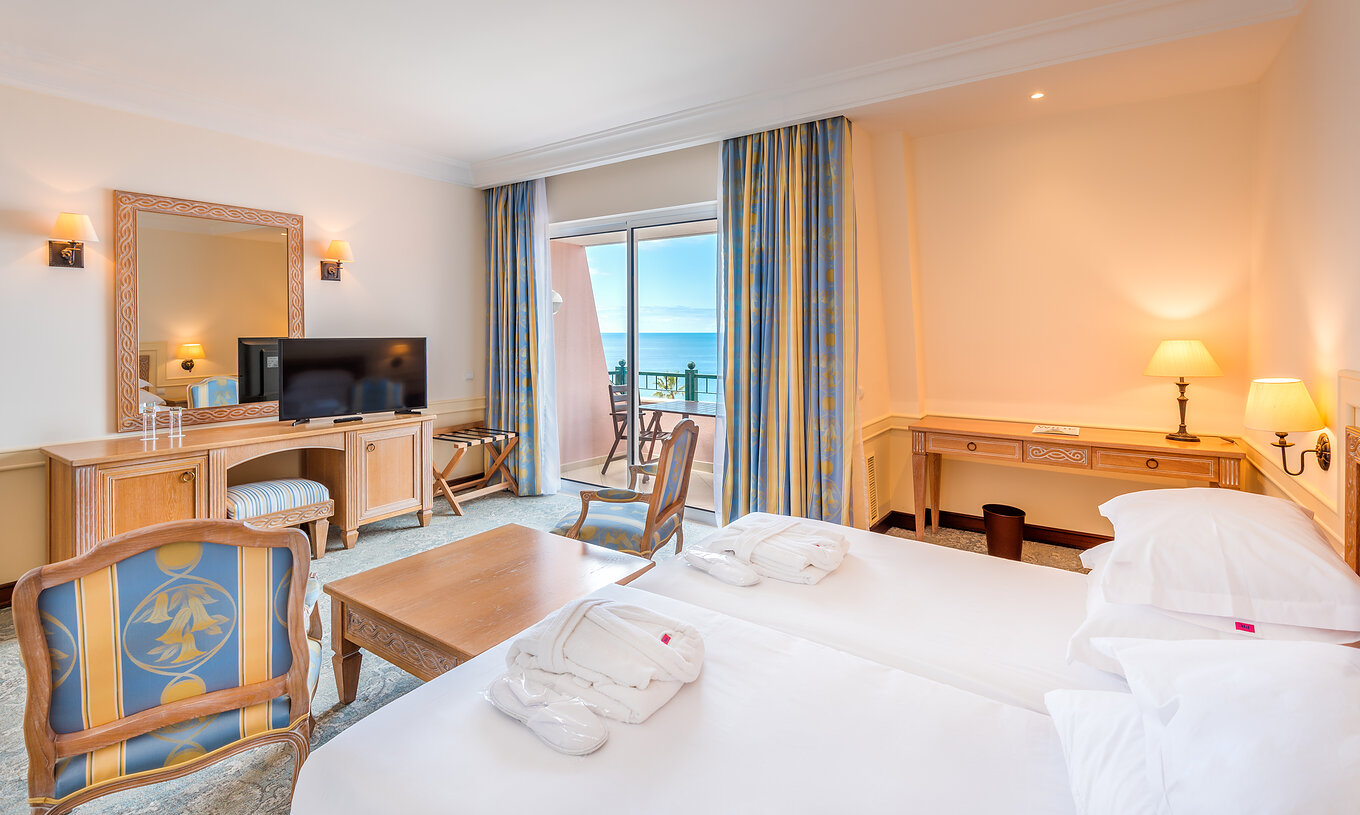 The Superior Deluxe Room with Balcony of Pestana Royal All Inclusive has television, table, and balcony with sea view
