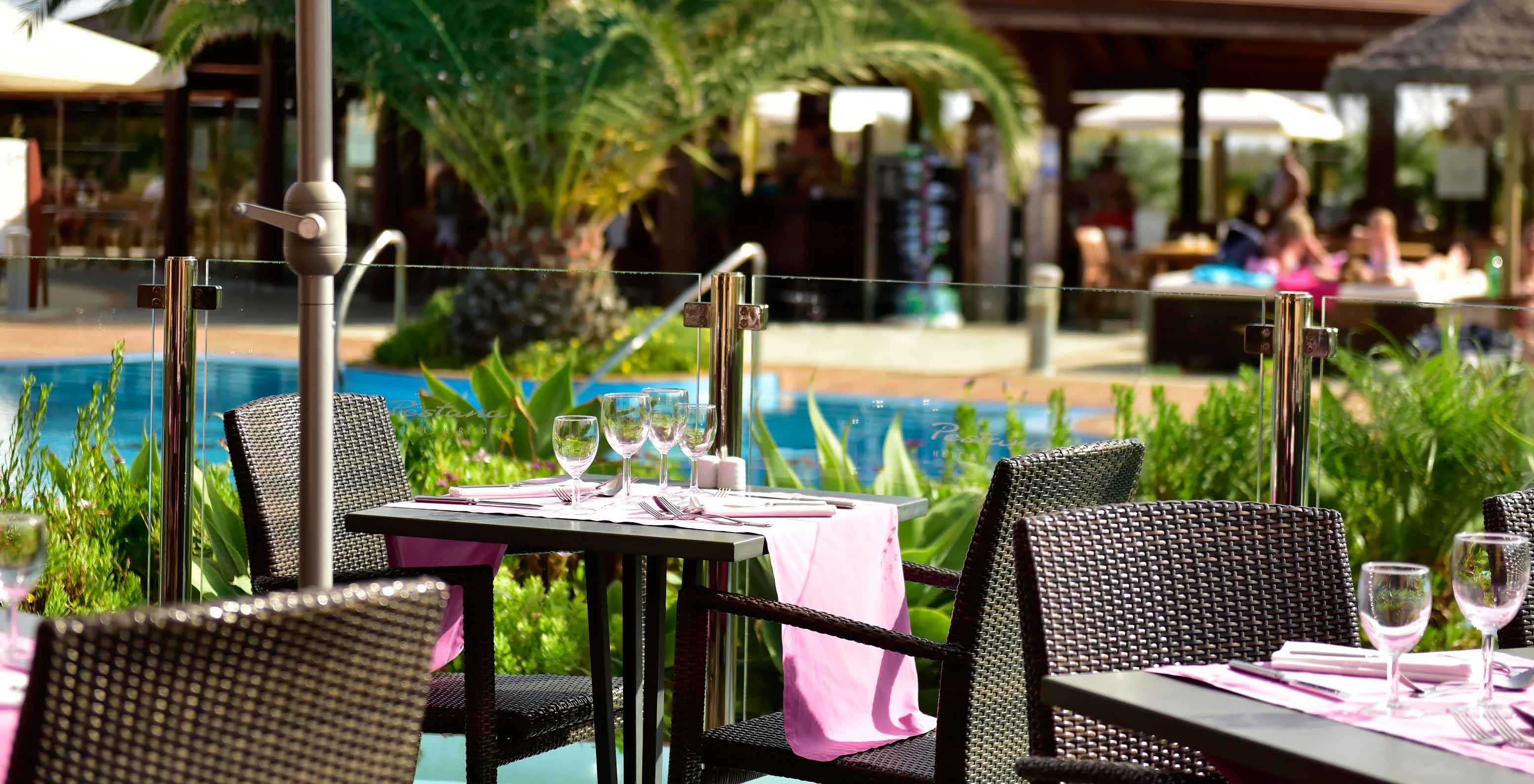 Marés Restaurant, 5-star Resort in Porto Santo has an outdoor area with tables, near the pool