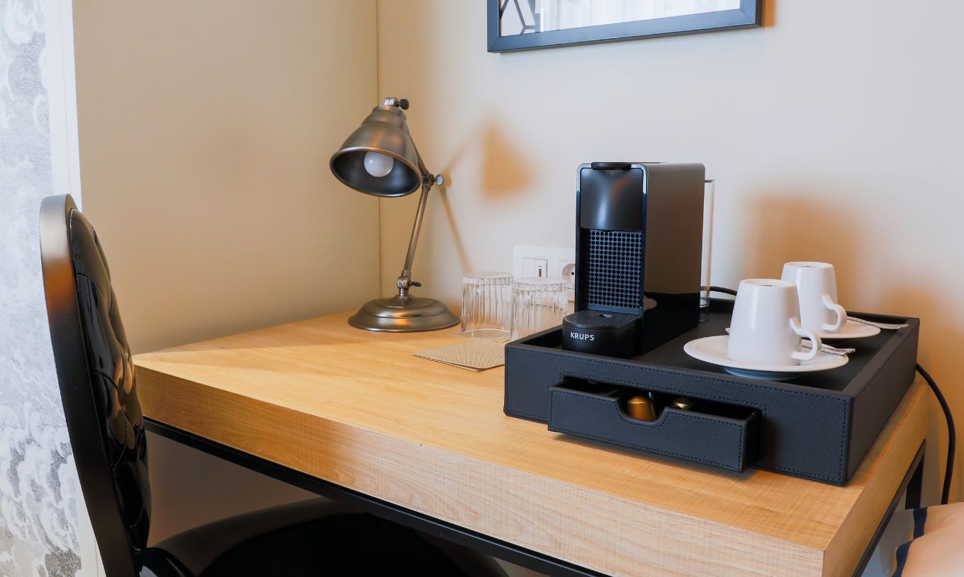 The Superior Plus Room at Pestana Plaza Mayor Madrid has a coffee station with a machine and coffee cups.