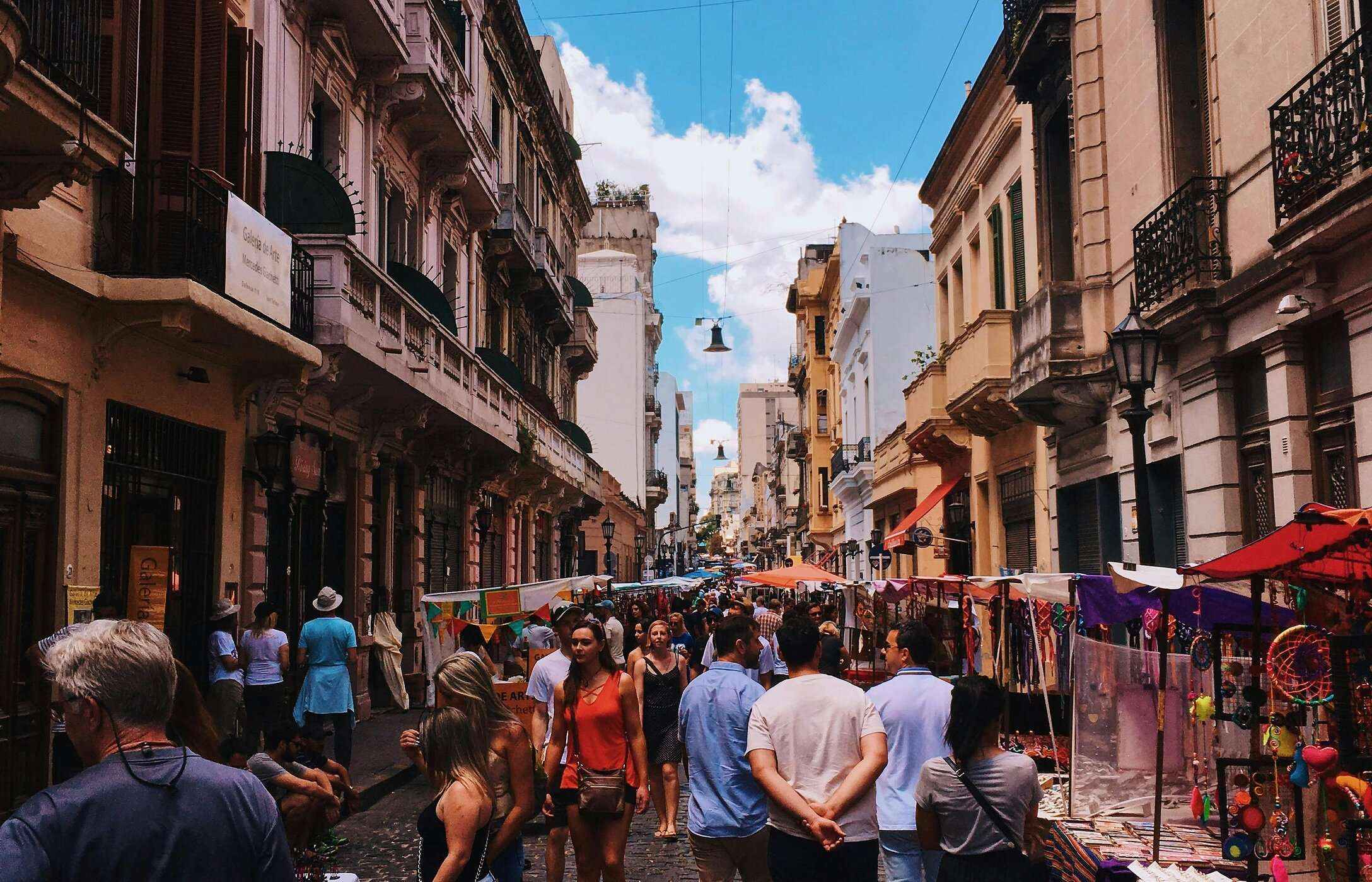 Bustling streets of Buenos Aires, Argentina, with stalls selling products and people walking around