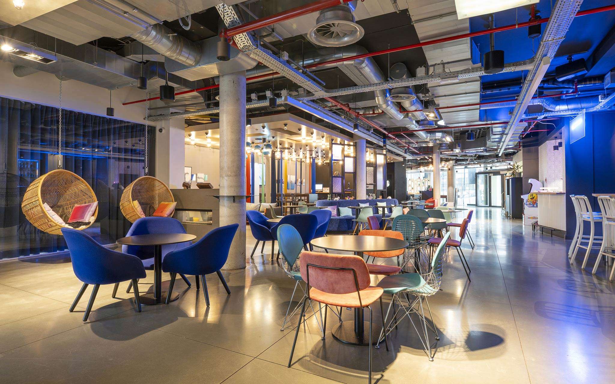 Tables and chairs from the bar and entrance of Pestana Brussels Schuman, a hotel in Brussels, Belgium