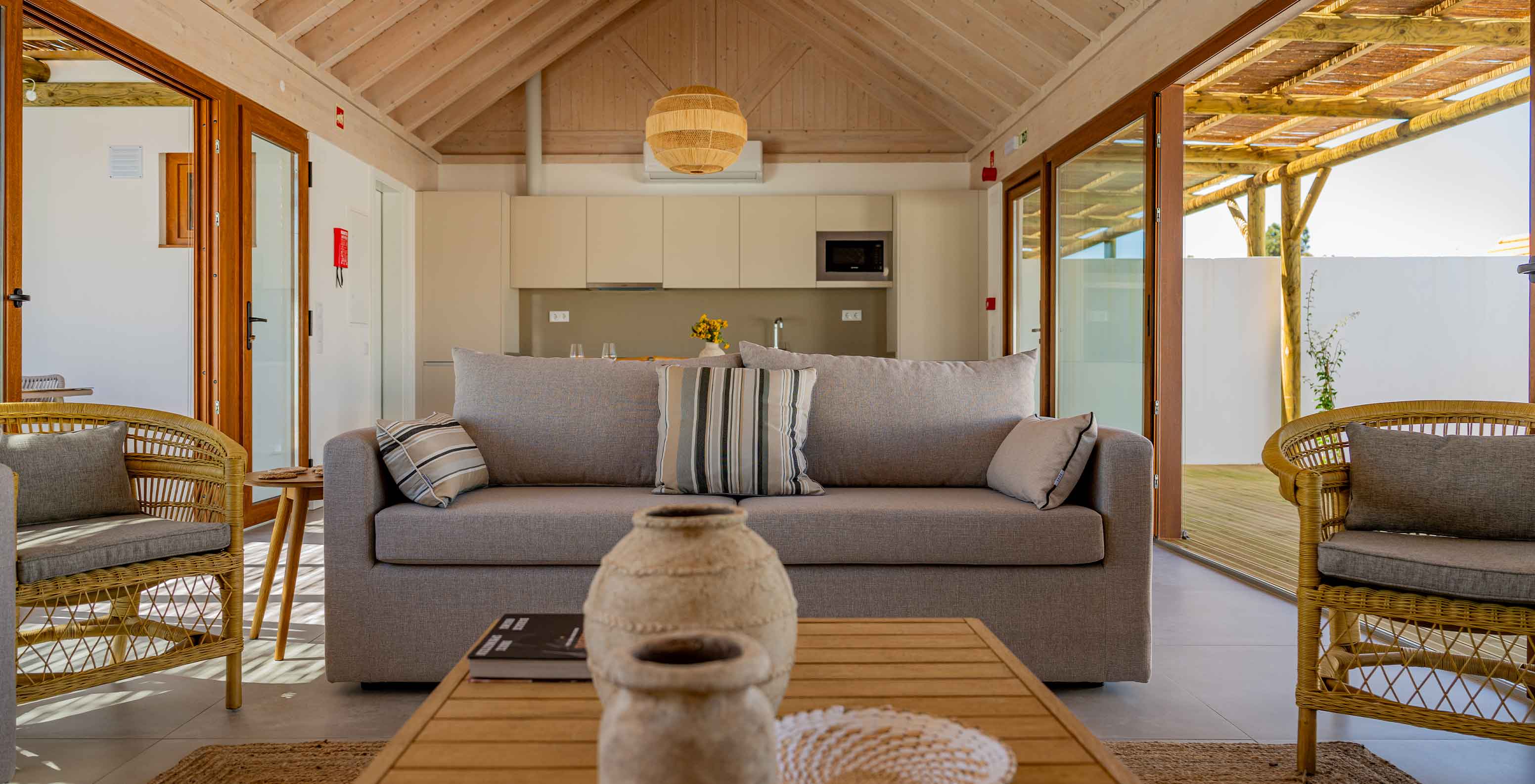 The Premium Green Villa at Pestana Comporta Village Residences has a bright living room with a sofa and decor