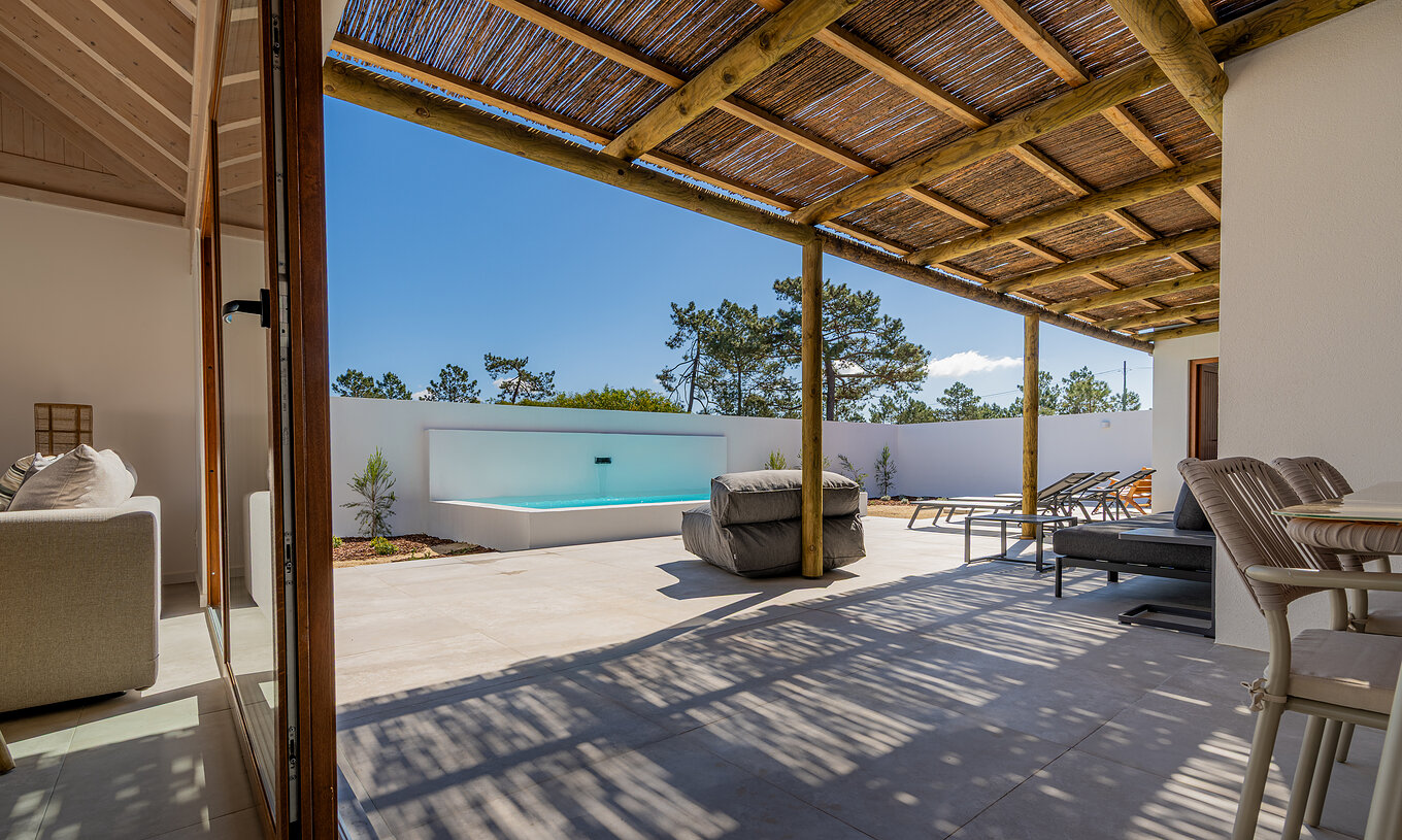 The Premium Villa at Pestana Comporta Village Residences has a patio with a pool and a wooden cover