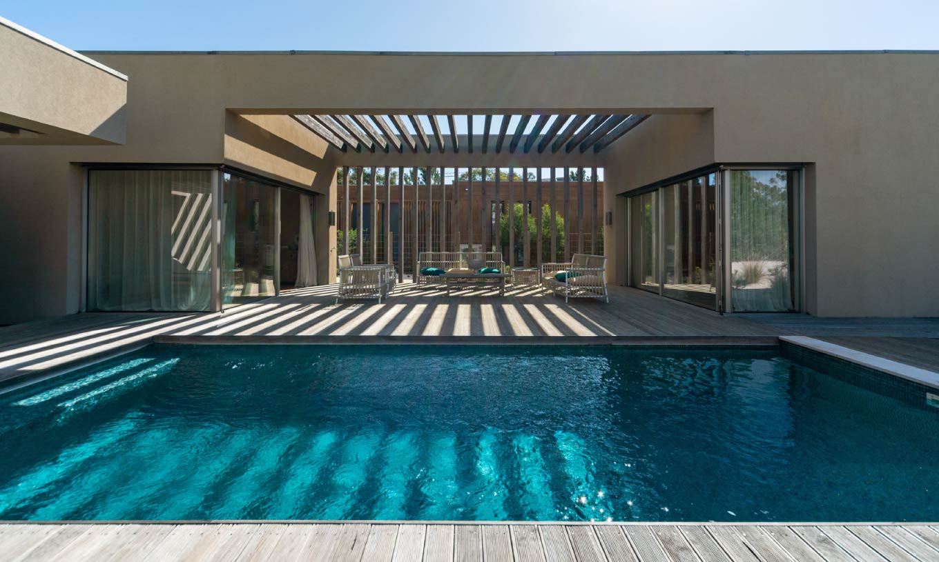 The exclusive villa with a pool at Pestana Tróia Eco Resort has an outdoor area with a terrace, a pool, and a seating area