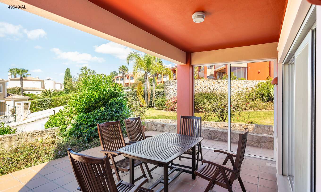 The Pestana Carvoeiro Golf T2 Superior Apartment has a balcony with a table and six wooden chairs