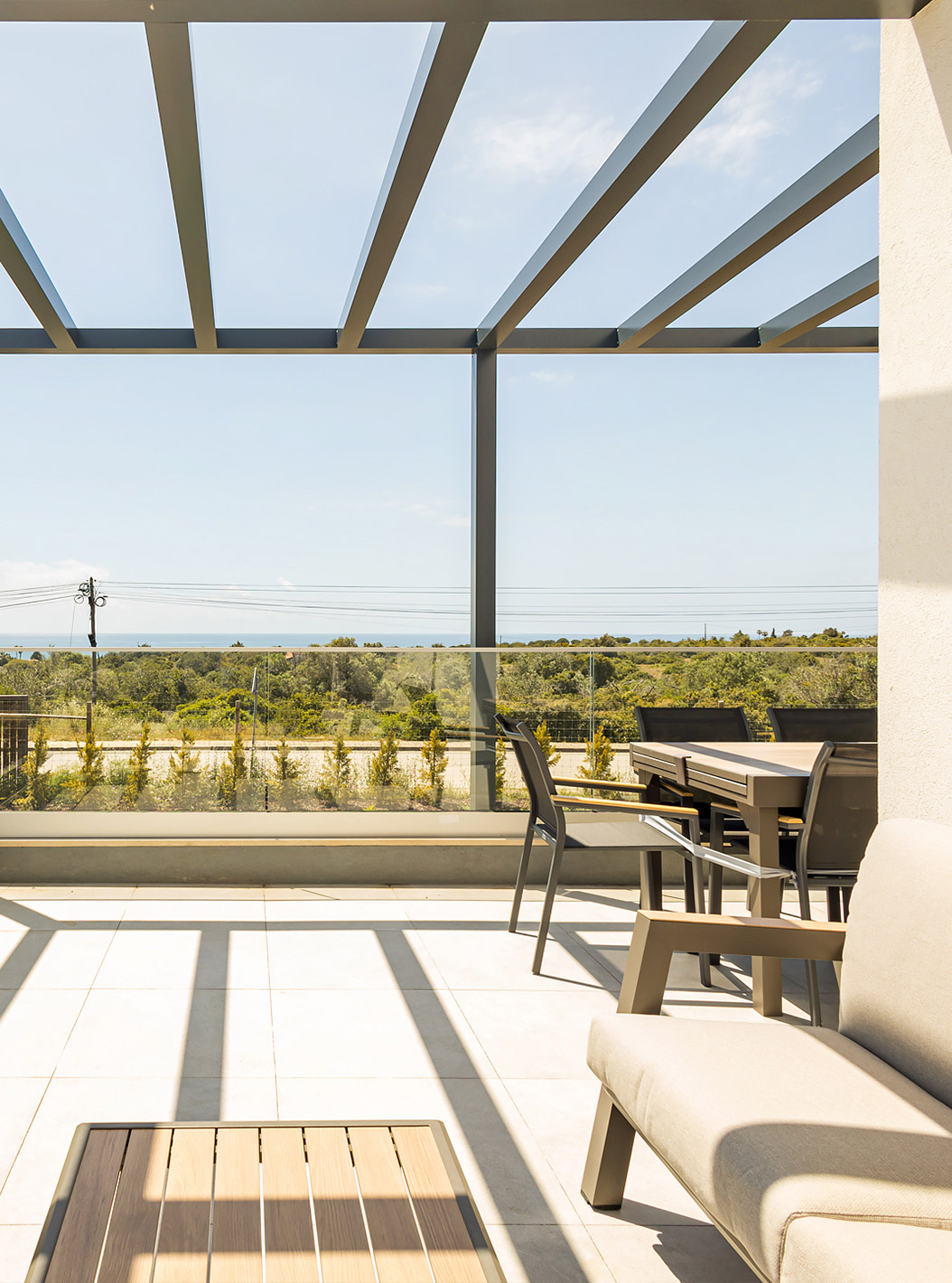 The First Floor 3 Bedroom Apartment - 4 Adults at Pestana Valley Nature Village has a terrace with sofas and a dining table