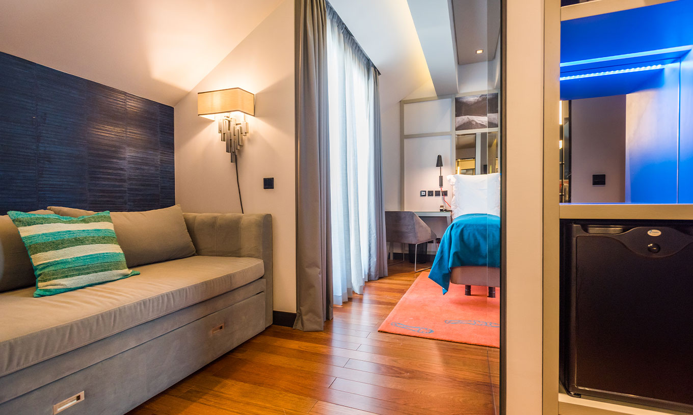 The CR7 Superior Rooftop Room at Pestana CR7 Lisboa includes a desk, sofa, and double bed