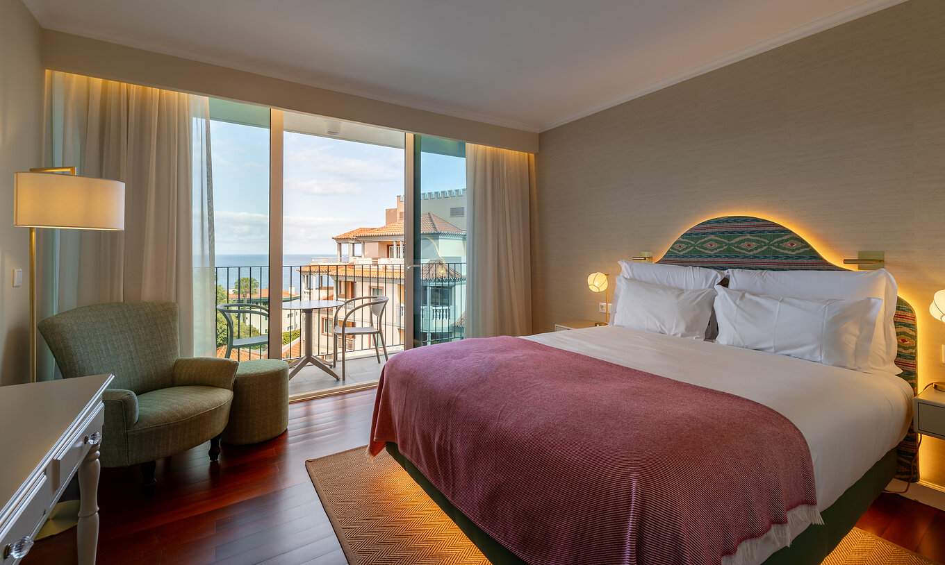 The Partial Sea View Room with Balcony at Pestana Quinta Perestrello has a double bed with a balcony and sea view.