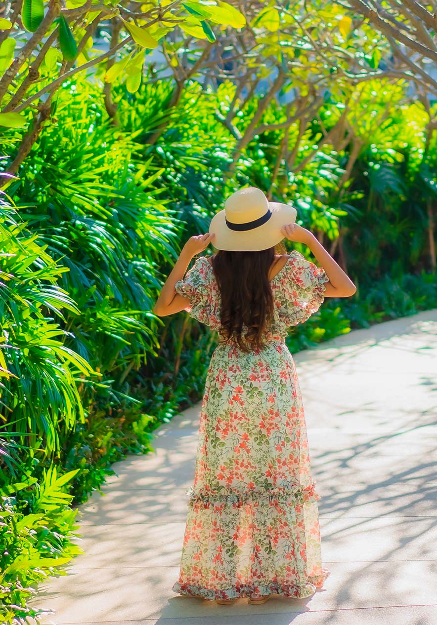 Woman walking in La Corniche amidst trees in nature
