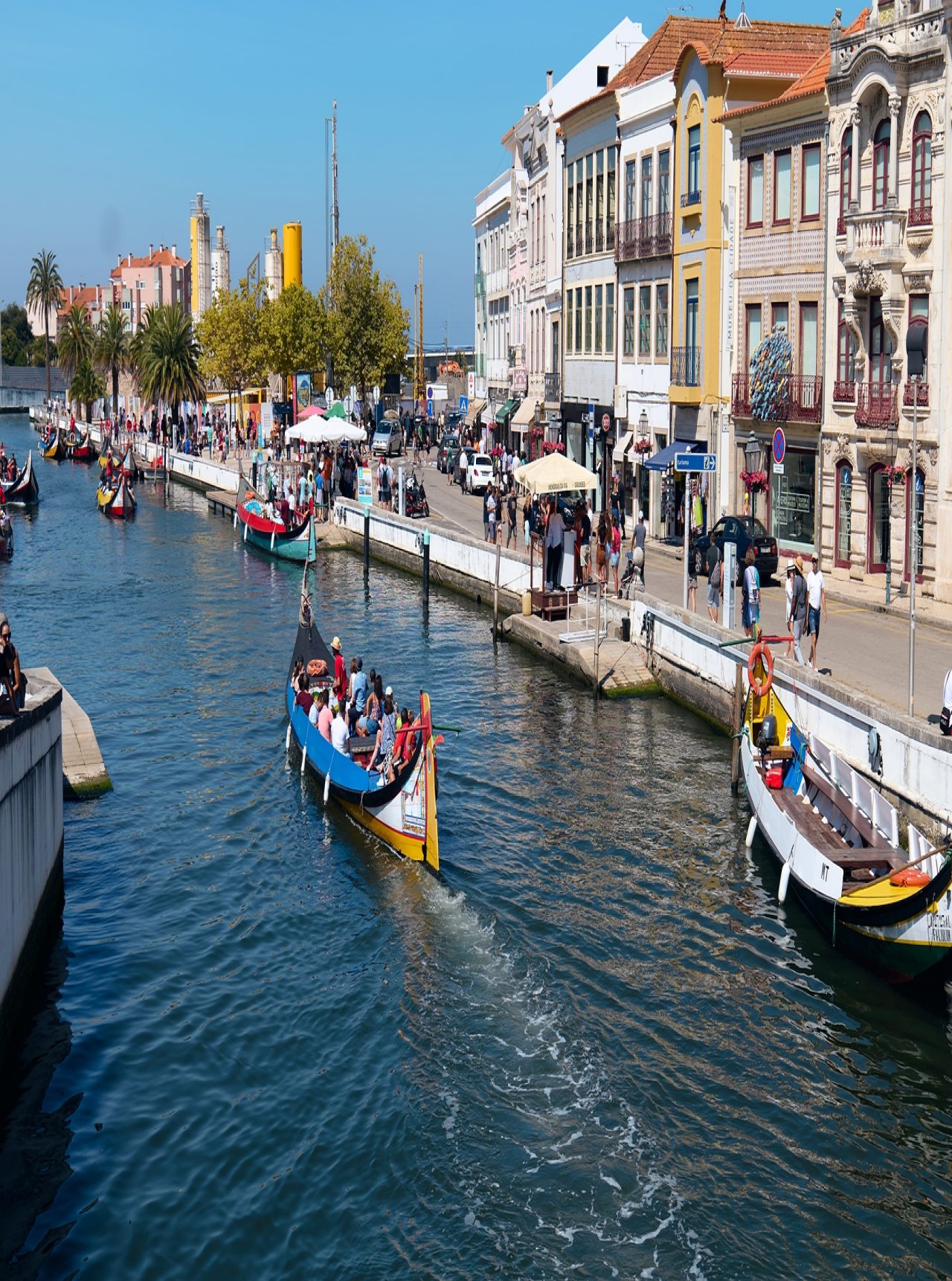 Ride on the historic moliceiros boats through the canals of Aveiro in Portugal
