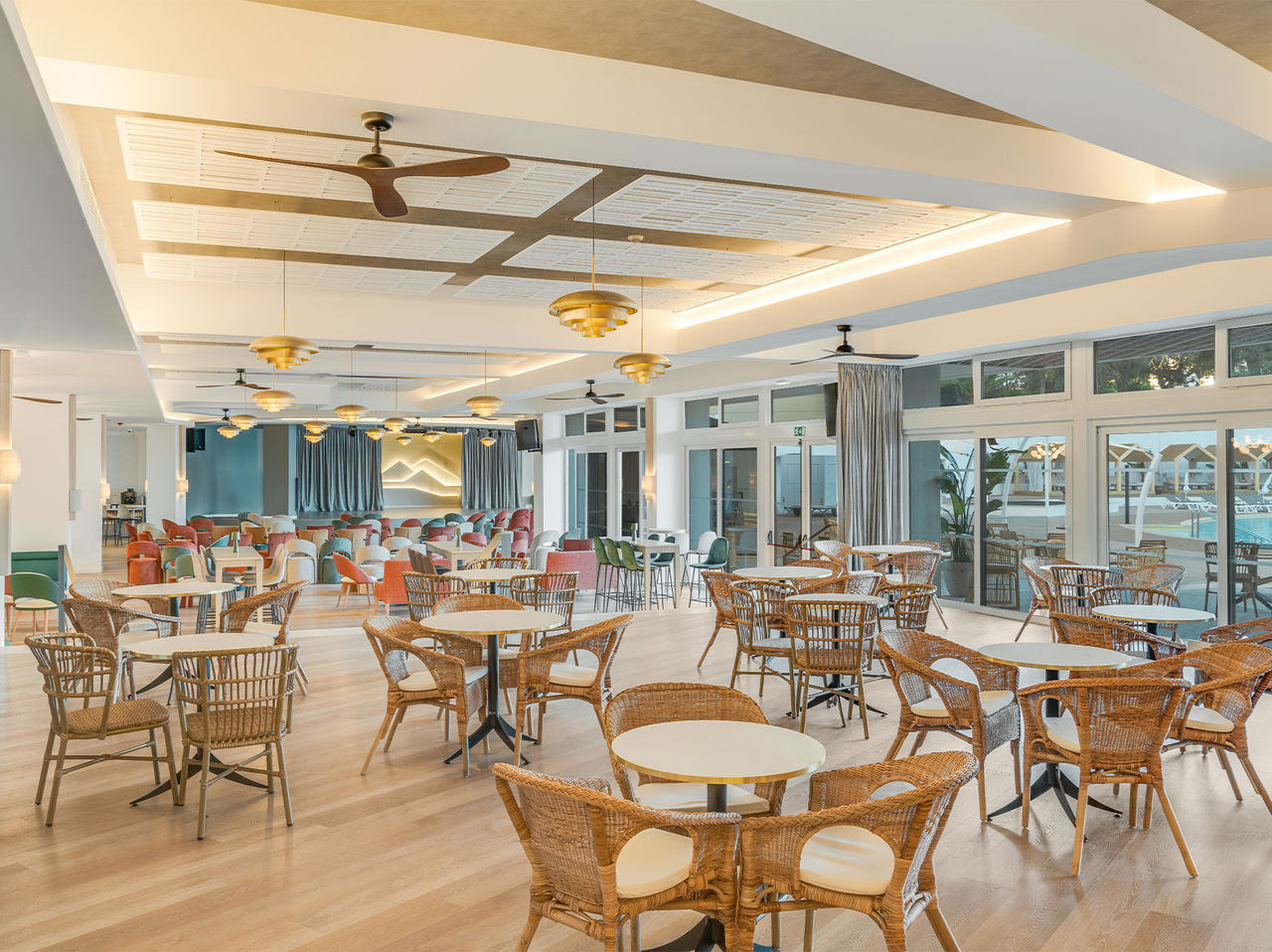 Coral Bar fills its space with natural light, offering a comfortable setting for a refreshing beverage