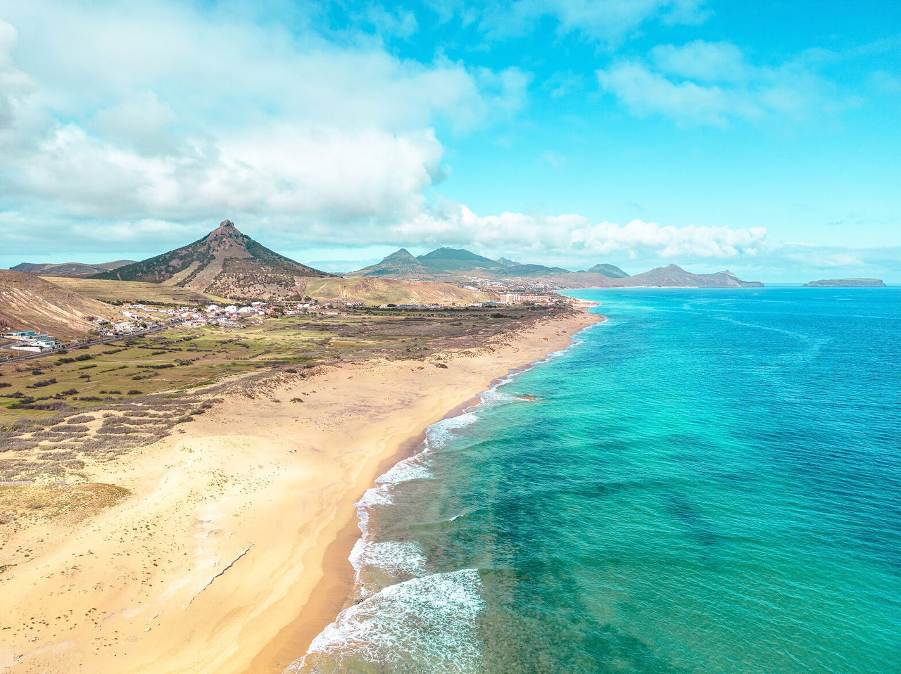 Panoramic view of the coast of Porto Santo, with its golden sandy beaches and turquoise blue water