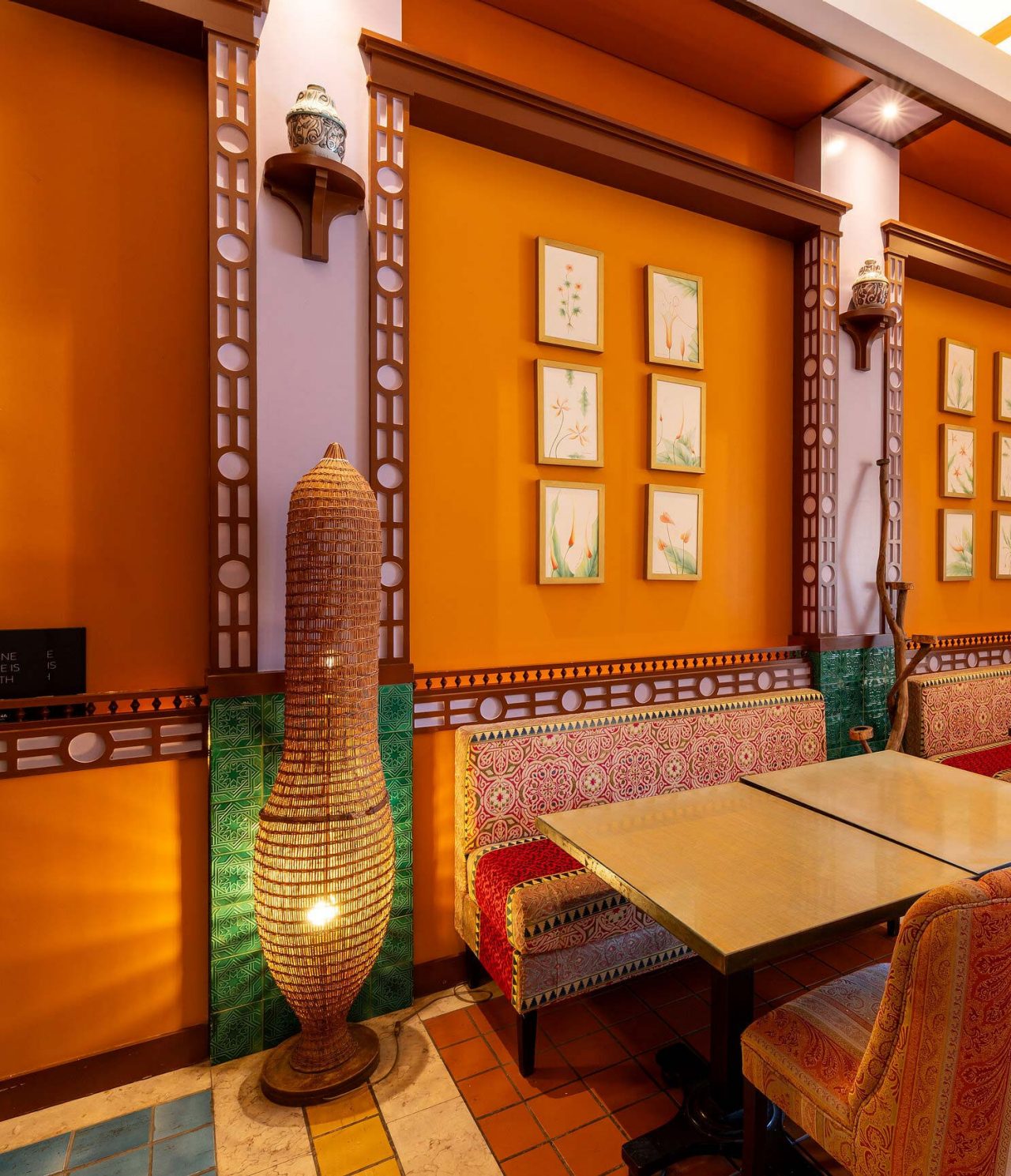 The Arab Magrebe restaurant at the 5-star Resort in Porto Santo features warm tones, square tables, and upholstered chairs.