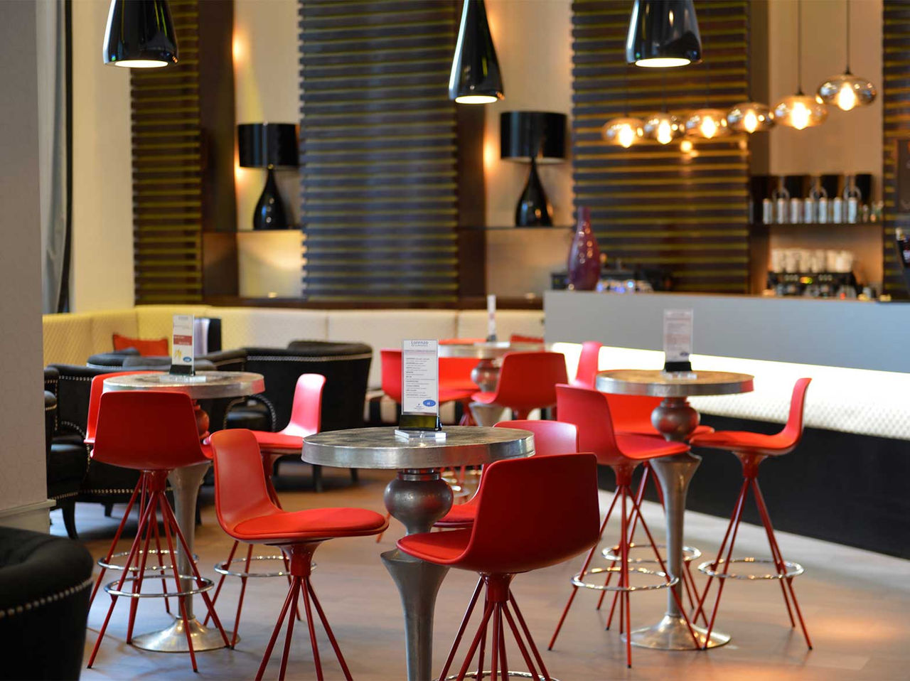 Lobby bar is cozy with tables for drinks and snack pairings